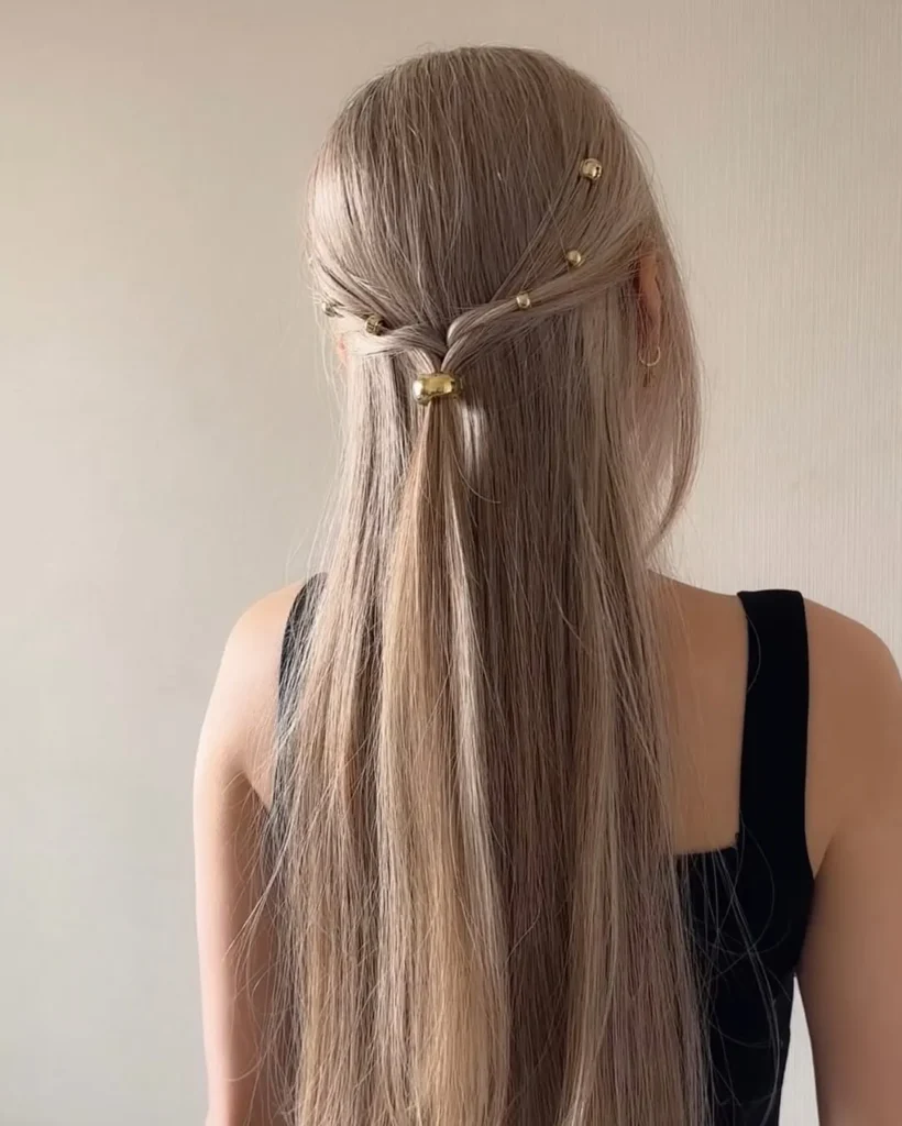 21 Glamorous Hairstyles for Straight Hair -That Showcase Its Natural Shine 8 Sleek Twist with Gold Accents – Modern Elegance for Straight Hair