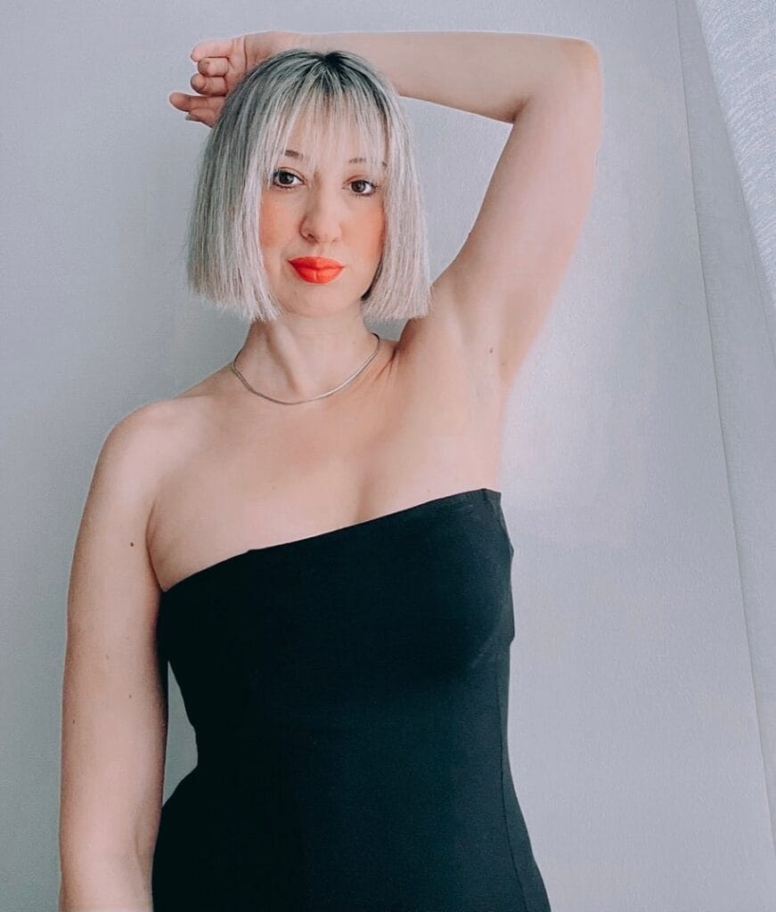18. Sleek Silver Bob with Blunt Bangs