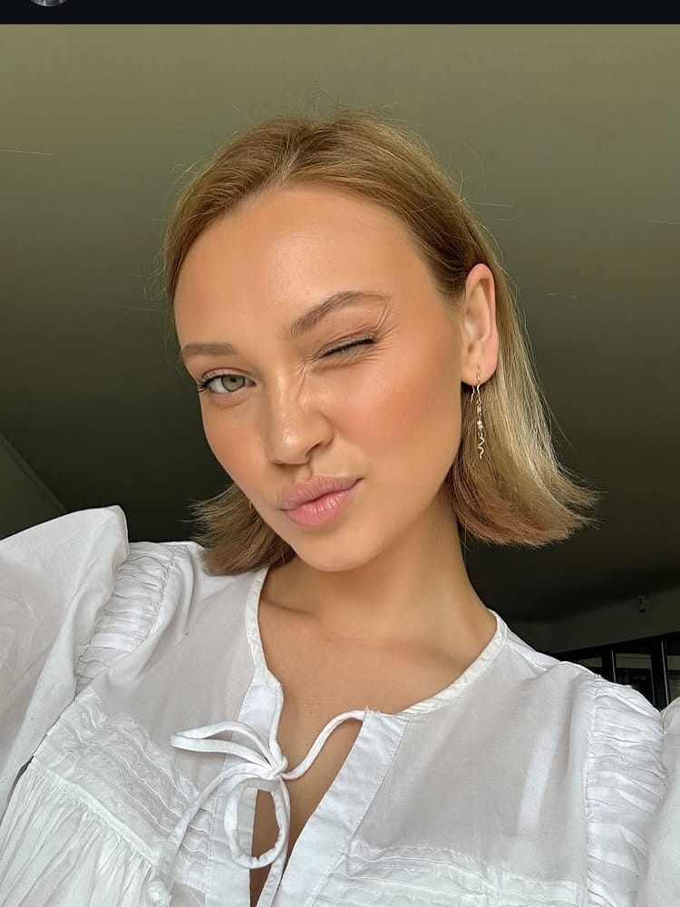 16. Flipped-Out Blonde Bob with Center Part