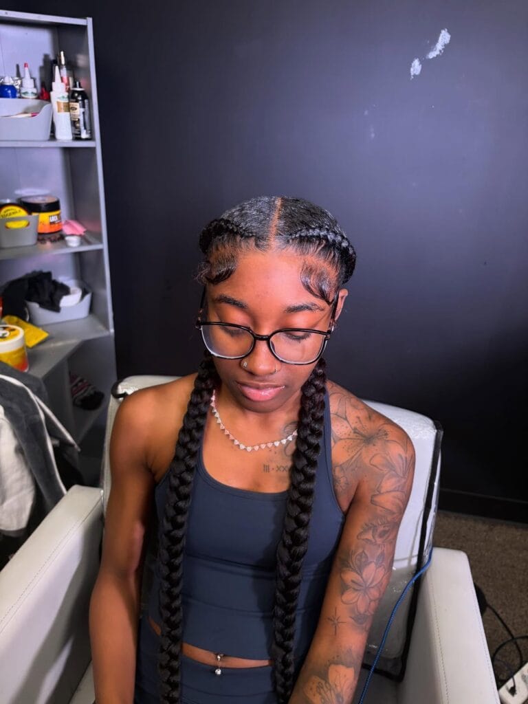 4. Neat Center-Part Two Long Braids