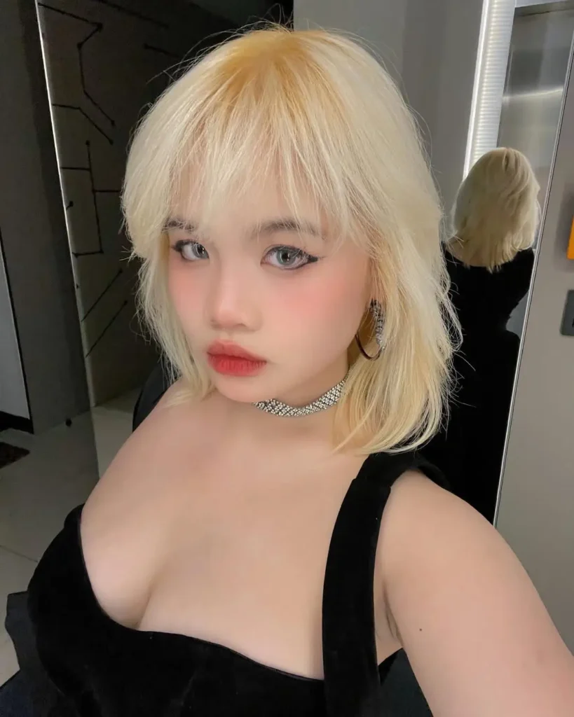 25 Trendy Wolf Haircut Ideas for Women: Chic Layers and Textures to Rock This Season 20 Soft Blonde Wolf Cut with Wispy Fringe and Subtle Layers