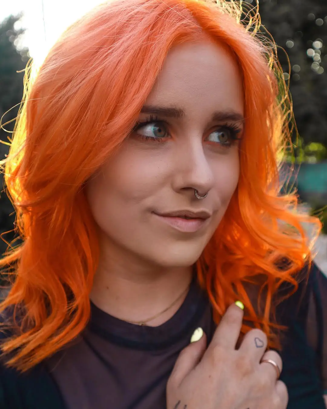 25 Trendy Wolf Haircut Ideas for Women: Chic Layers and Textures to Rock This Season 26 Vibrant Orange Wolf Cut with Soft Waves and Center Part