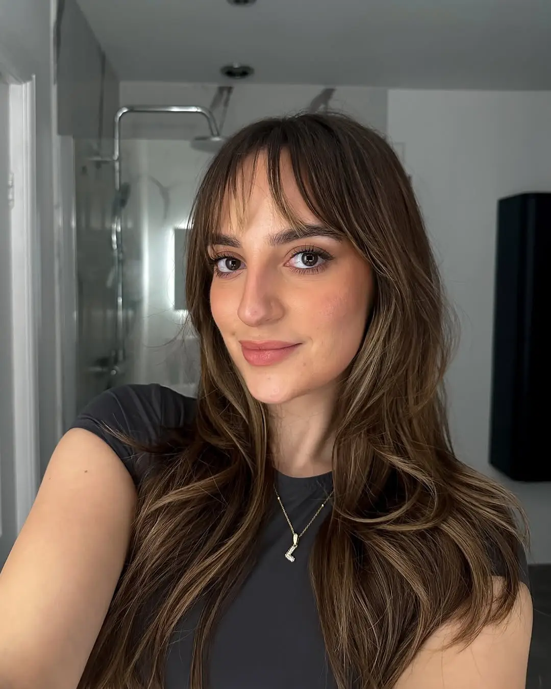#10. Face-Framing Fringe with Long Brunette Layers