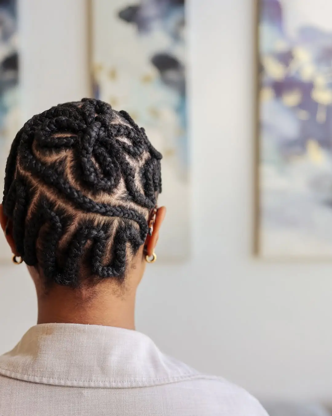19 Stunning 4c Braided Hairstyles: Bold Looks That Celebrate Natural Texture 11 #10. Sculpted Patterned Cornrows on Tapered Cut