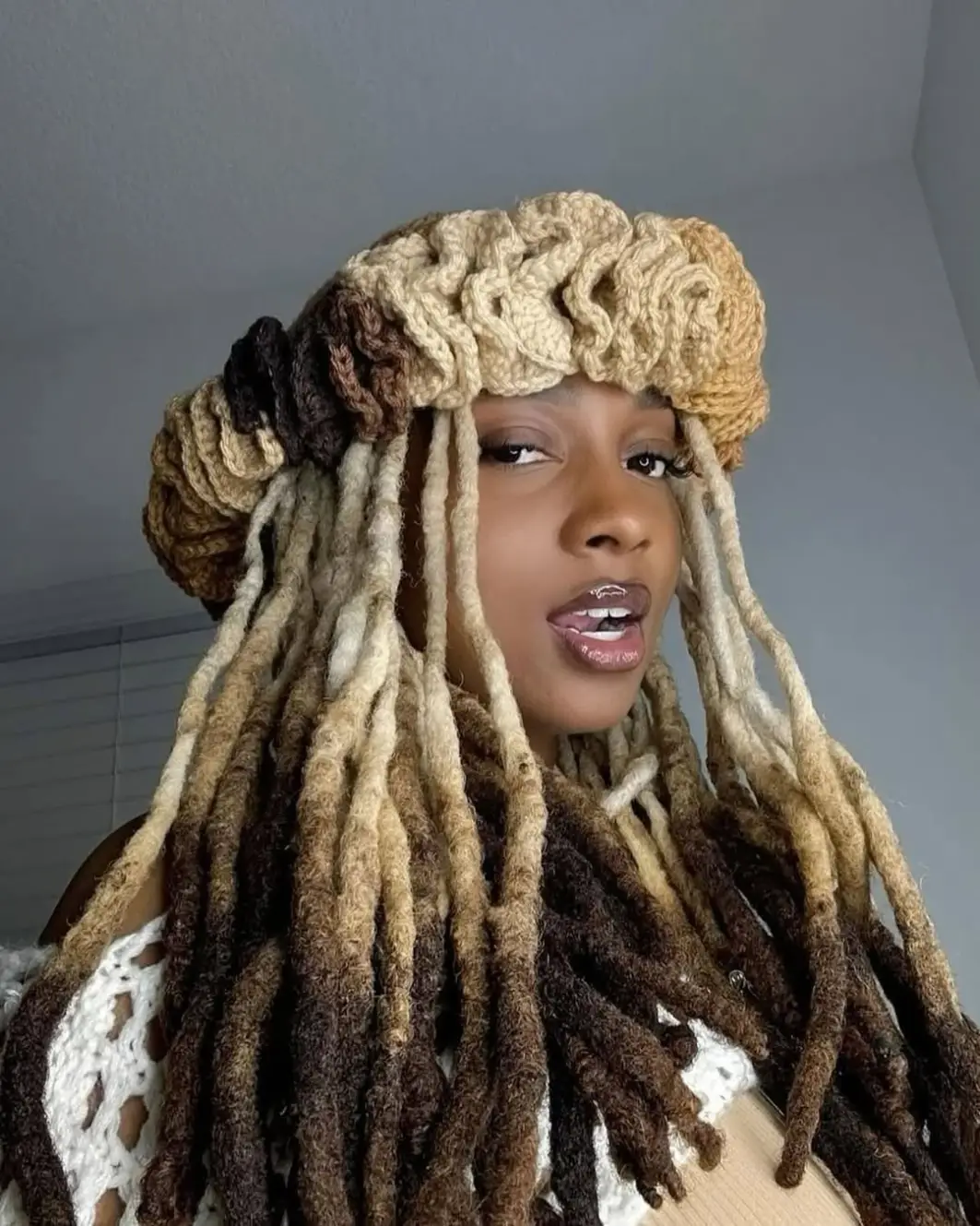 19 Creative Locs Hairstyles: Statement-Making Styles to Try Now 12 #11. Chunky Ombre Locs with Crocheted Crown Cap