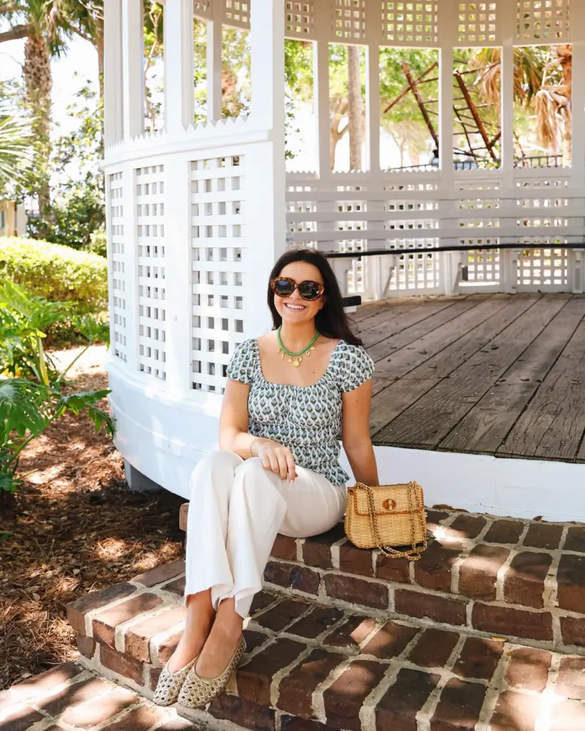 20 Preppy Outfit Ideas for a Polished Travel Wardrobe 14 #13. Puff-Sleeve Blouse and White Trousers – Garden Prep with Southern Charm