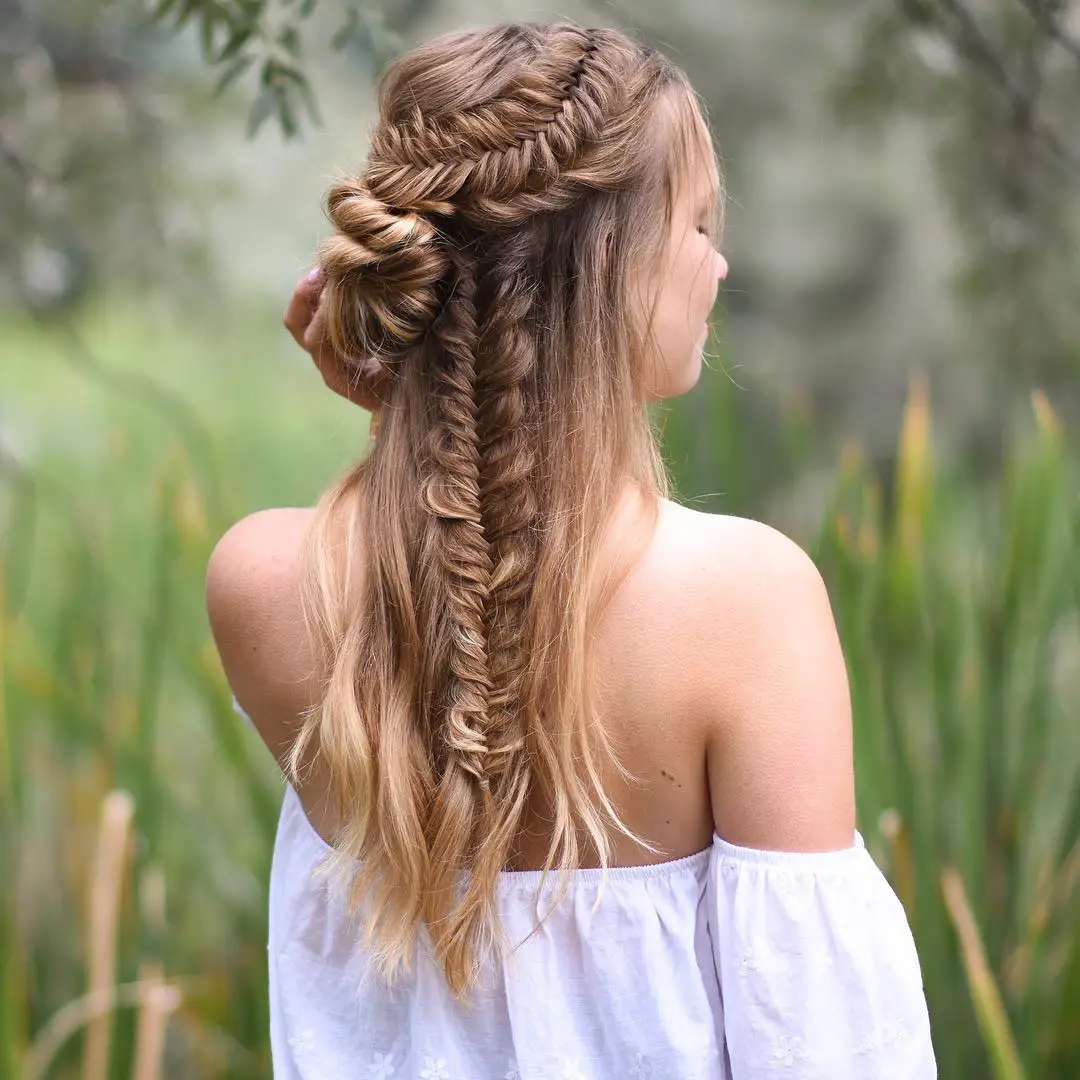 21 Sleek Rainy-Day Hairstyles: Easy Ways to Tame the Frizz 16 #15. Double Fishtail Braids with Twisted Half Bun
