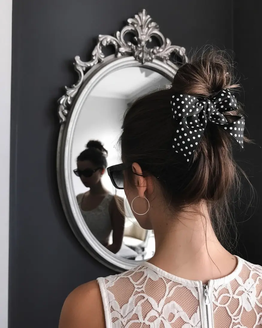 19 Clever Hairstyles For Greasy Hair: Quick Fixes That Still Look Fresh 18 #17. Textured Top Knot with Polka Dot Bow