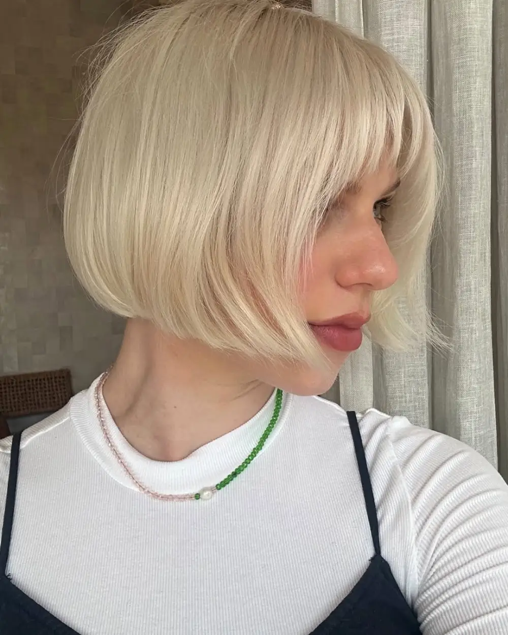 #19. Icy Blonde Bob with Soft Fringe