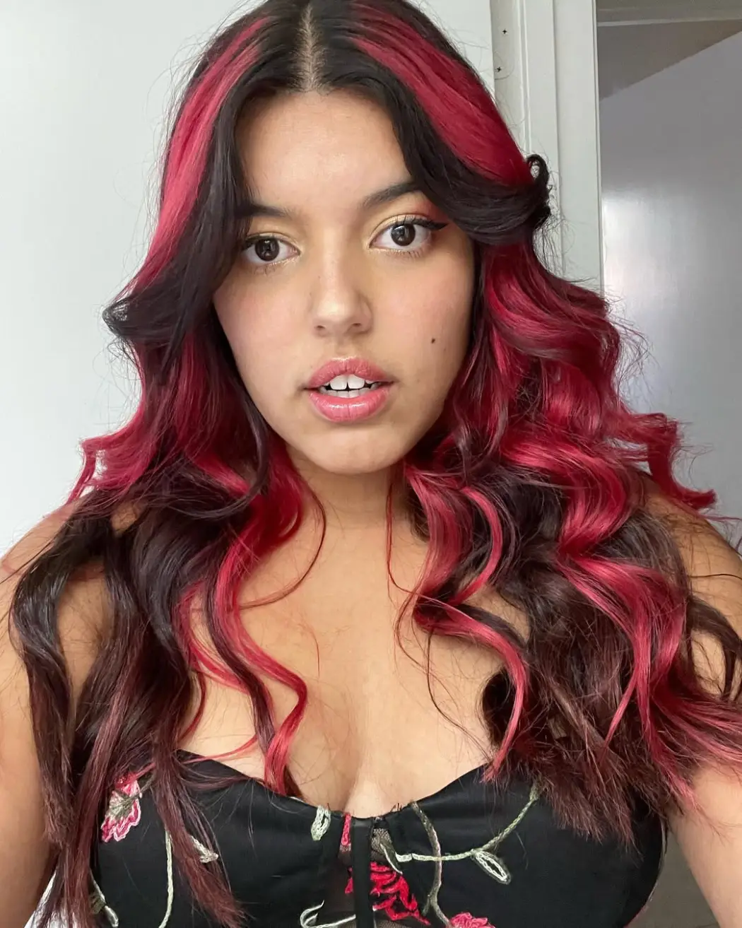 #25. Voluminous Waves with Crimson Peekaboo Highlights