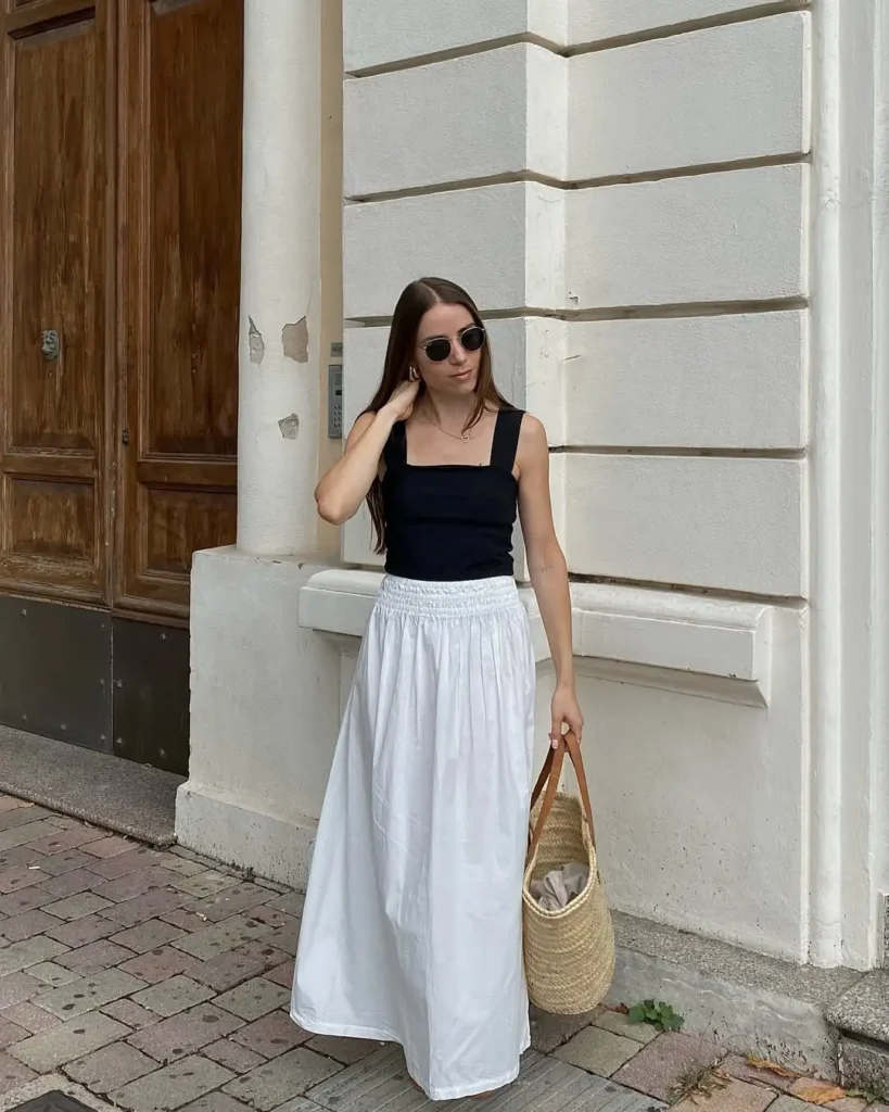 #3. Black Square-Neck Tank with White Maxi Skirt and Woven Tote