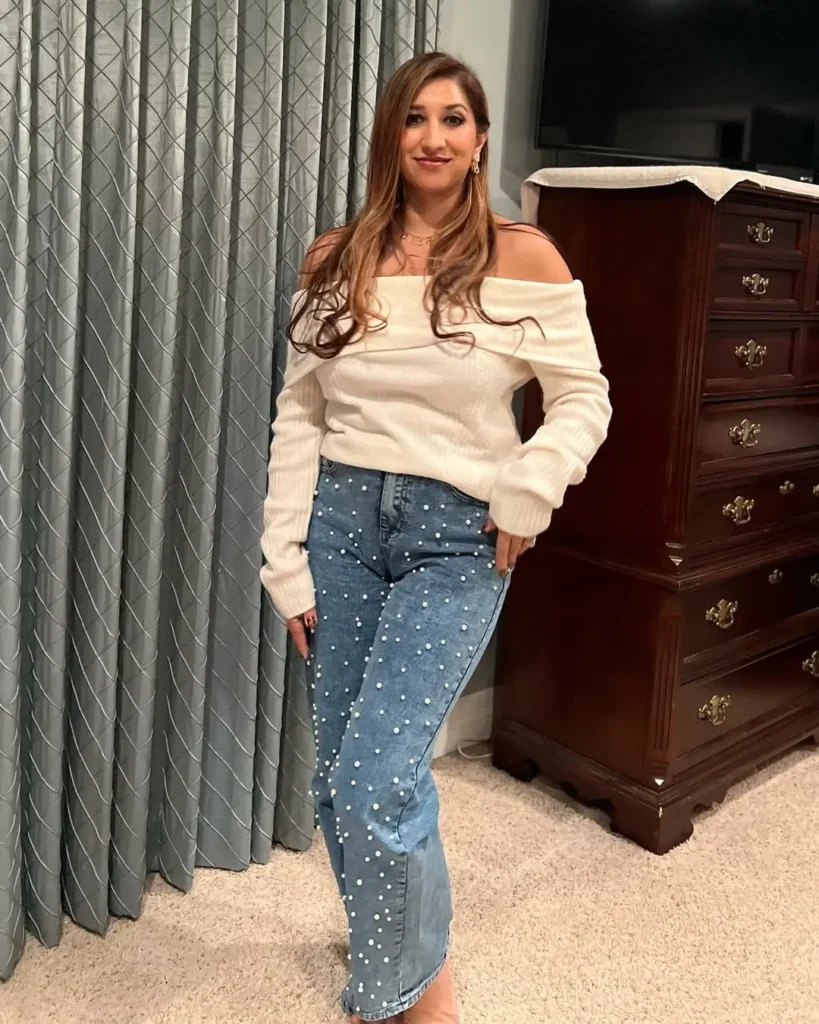 #6. Off-Shoulder Sweater with Pearl-Embellished Denim