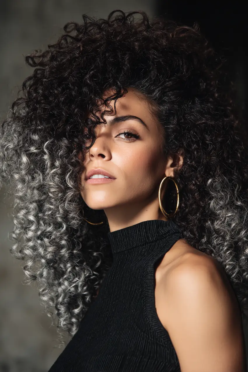 24 Striking Brown Hair with Silver Highlights Ideas: Sophisticated Looks to Refresh Your Style 7 #6. Voluminous Curly Brown Hair with Frosted Silver Tips