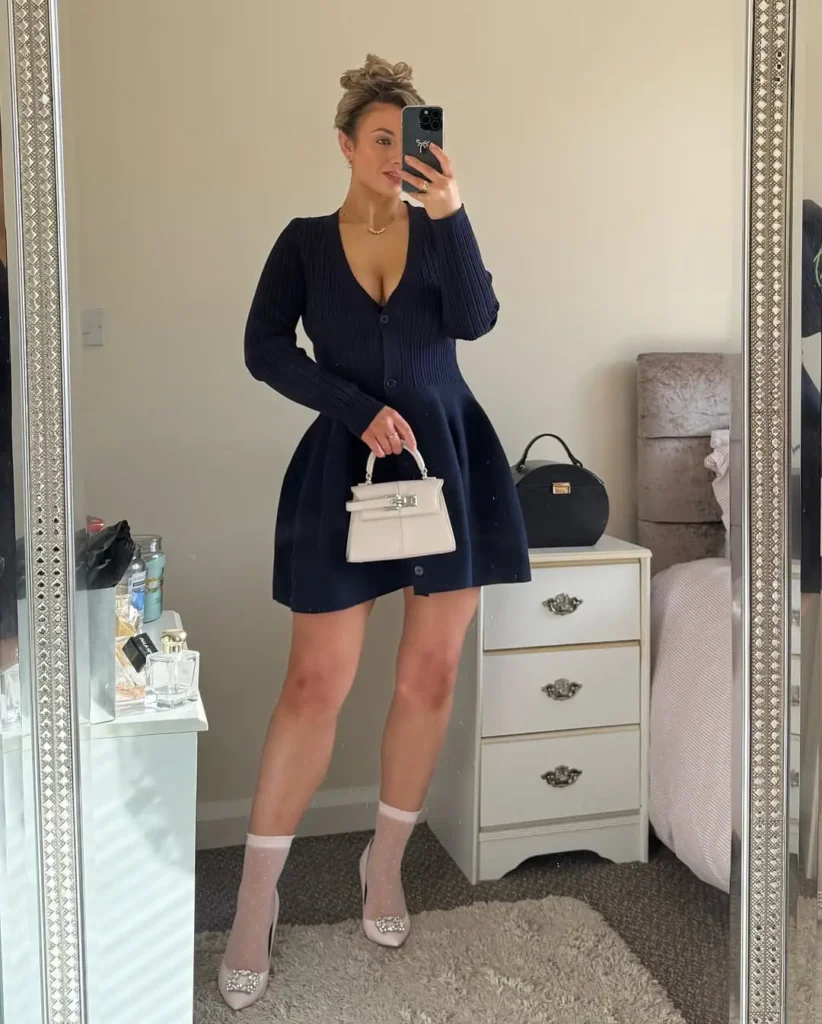 20 Preppy Outfit Ideas for a Polished Travel Wardrobe 8 #7. Navy Fit-and-Flare Knit Dress – Playful Prep with Vintage Parisian Flair