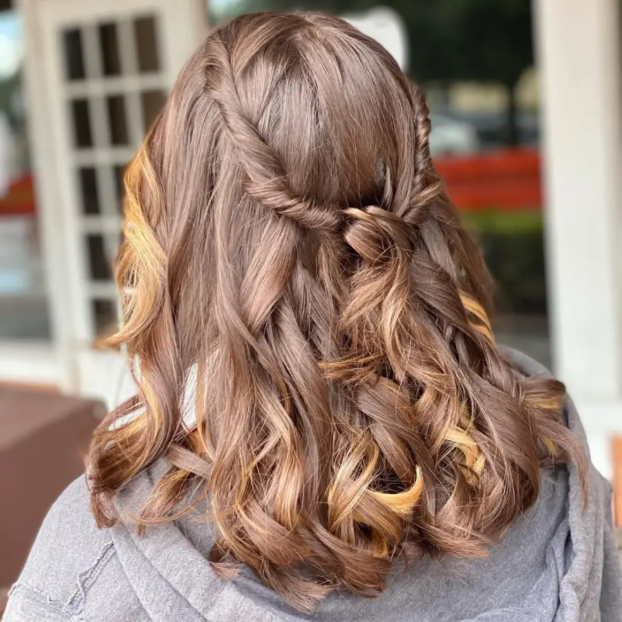 #7. Twisted Half-Up Curls with Honey-Toned Highlights