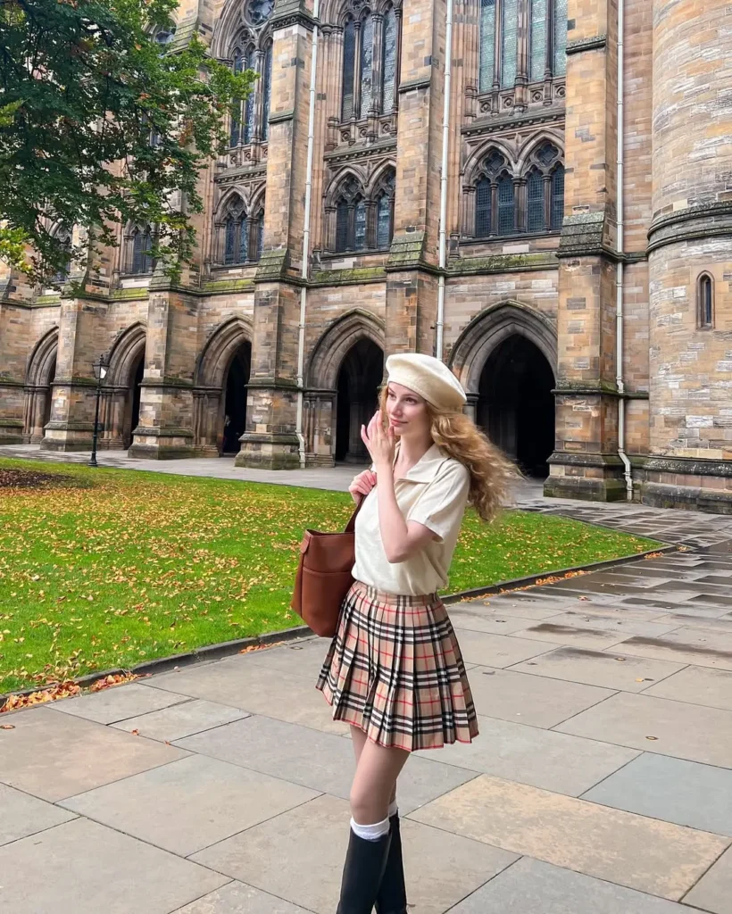 20 Preppy Outfit Ideas for a Polished Travel Wardrobe 9 #8. Plaid Pleated Skirt and Beret – Academic Prep with Paris-London Charm