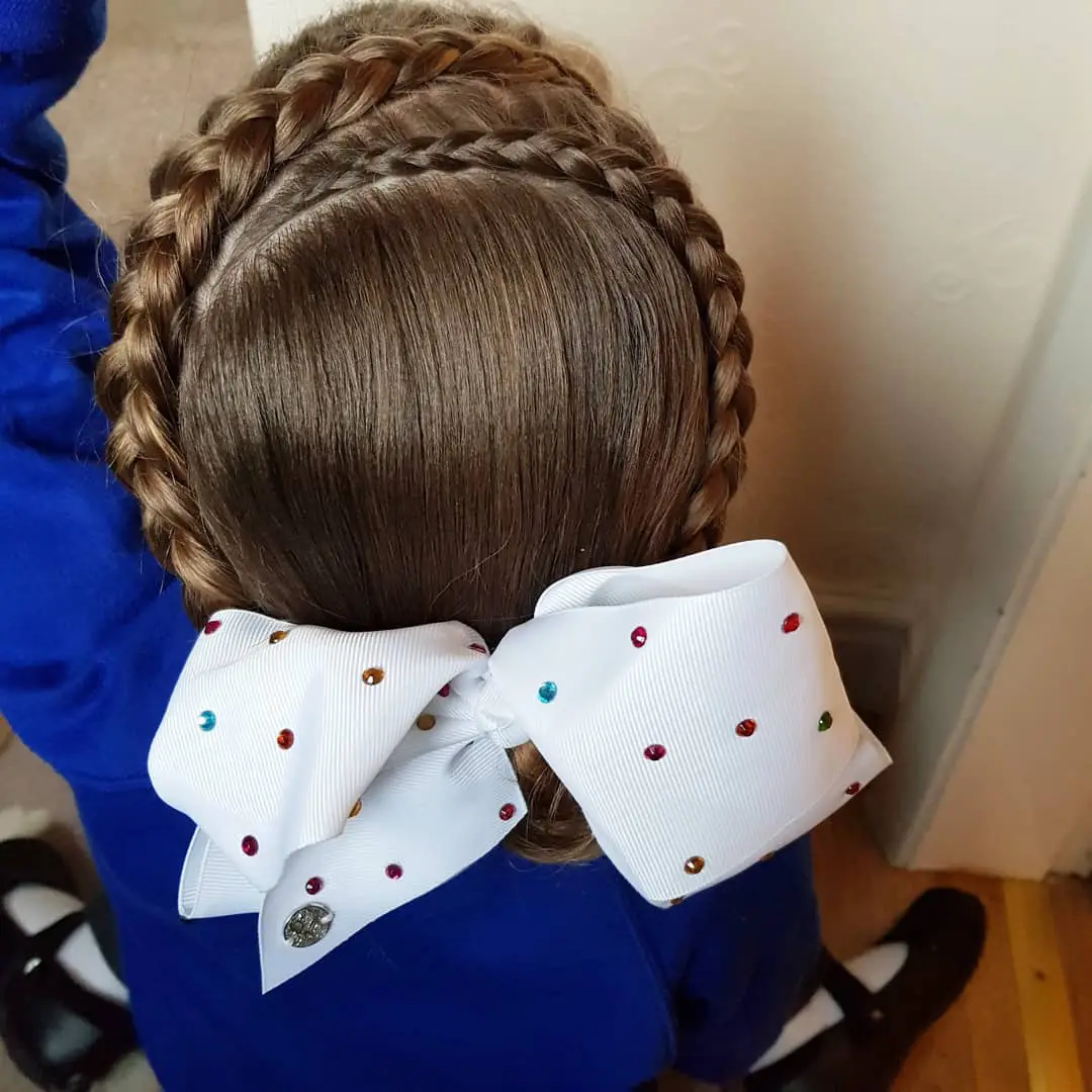 22 Refreshing Hairstyles for Swimming: Stylish Looks That Stay Put in the Water 8 Dutch Braided Crown into Low Bun with Bow Accent