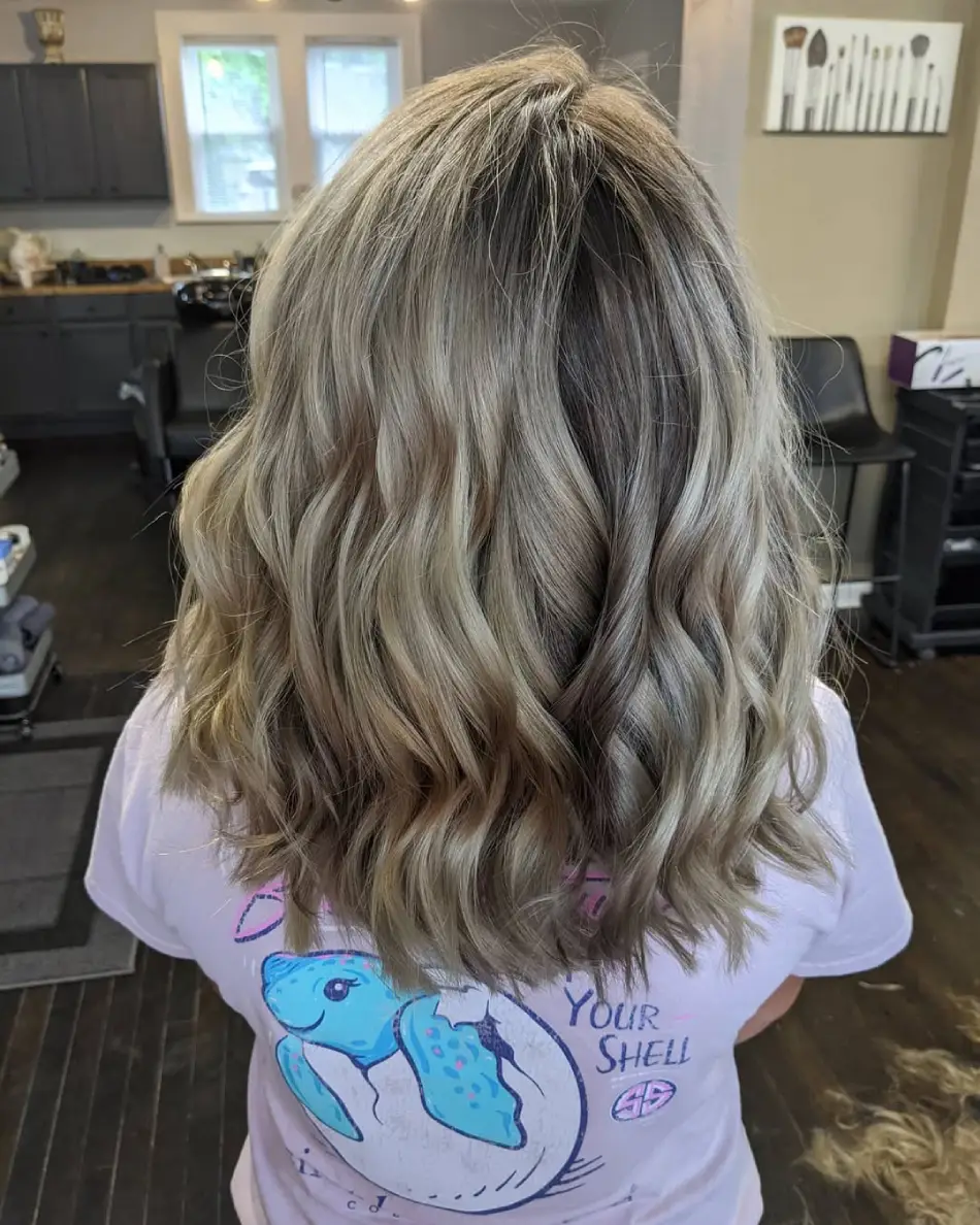 20 Stylish Hairstyles for Teenage Girls: Everyday Hair Inspo for School and Beyond 17 Icy Blonde Waves with Soft Root Shadow