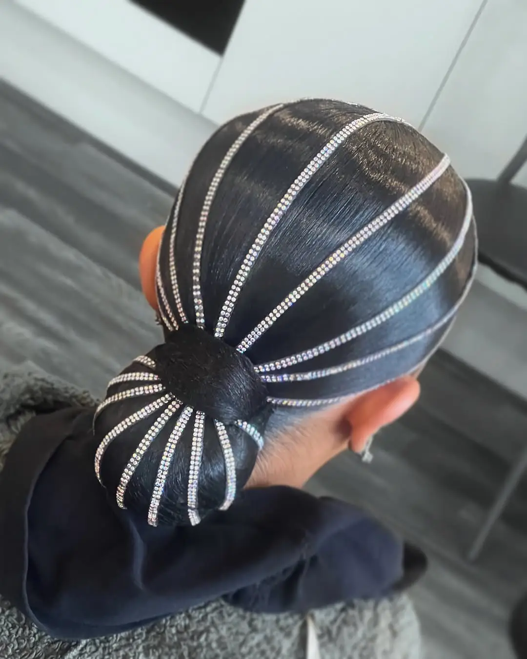 26 Bold Dance Hairstyles: Show-Stopping Styles for Stage and Studio 5 Radiant Rhinestone Web Sleek Bun