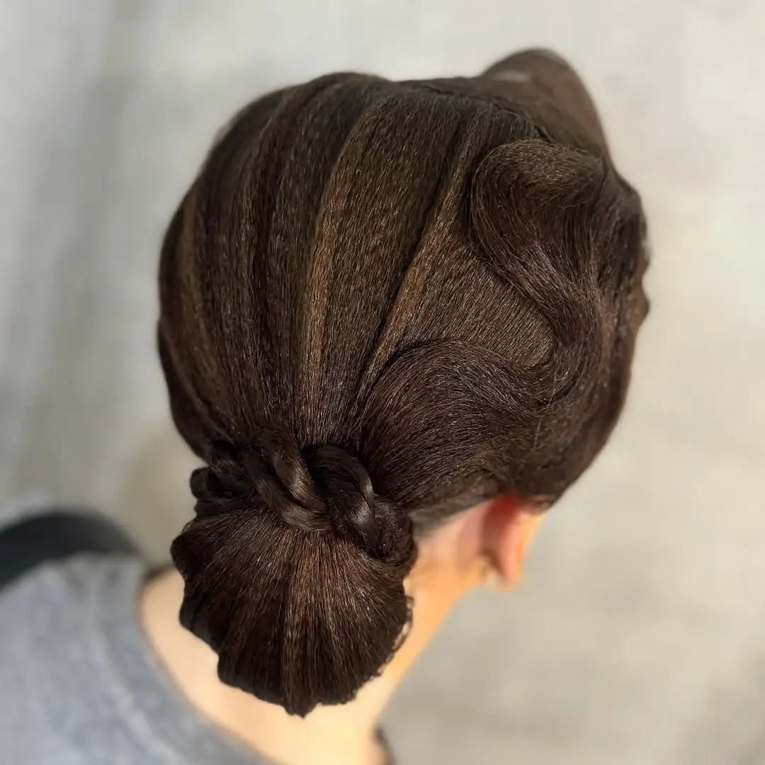 26 Bold Dance Hairstyles: Show-Stopping Styles for Stage and Studio 25 Sculpted Wave Ballroom Bun