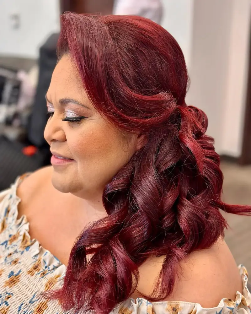 Side-Swept Burgundy Curls with Vintage Volume