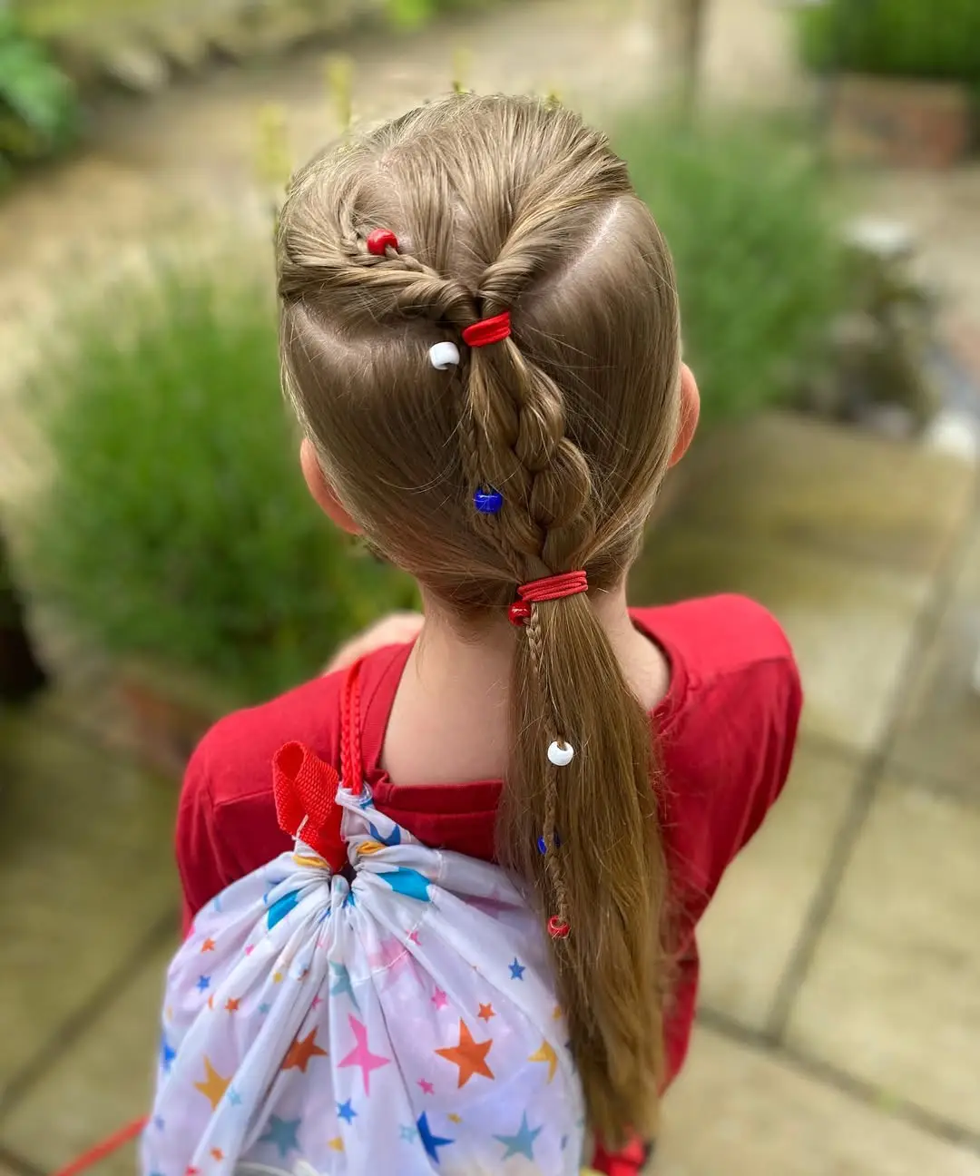 22 Refreshing Hairstyles for Swimming: Stylish Looks That Stay Put in the Water 20 Topsy Tail Half-Up Braid with Colorful Beads