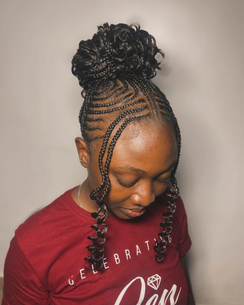 5. Curly Bun Cornrows with Face-Framing Braids