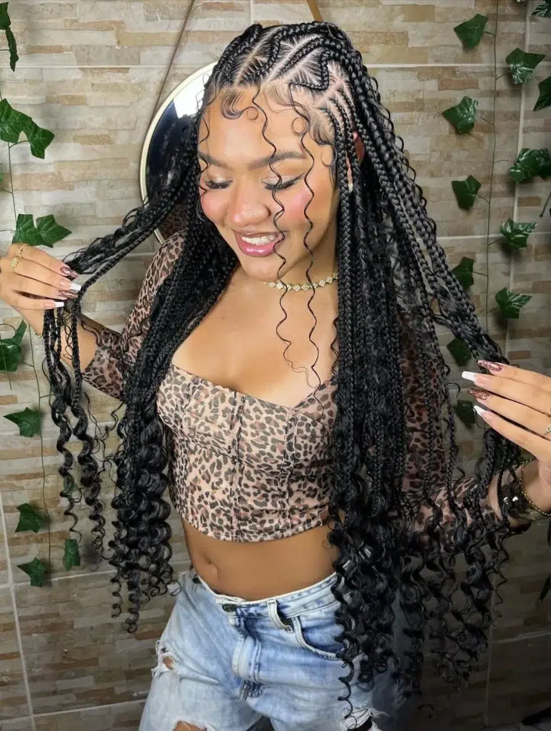 10. Cornrows with Long Loose Curls