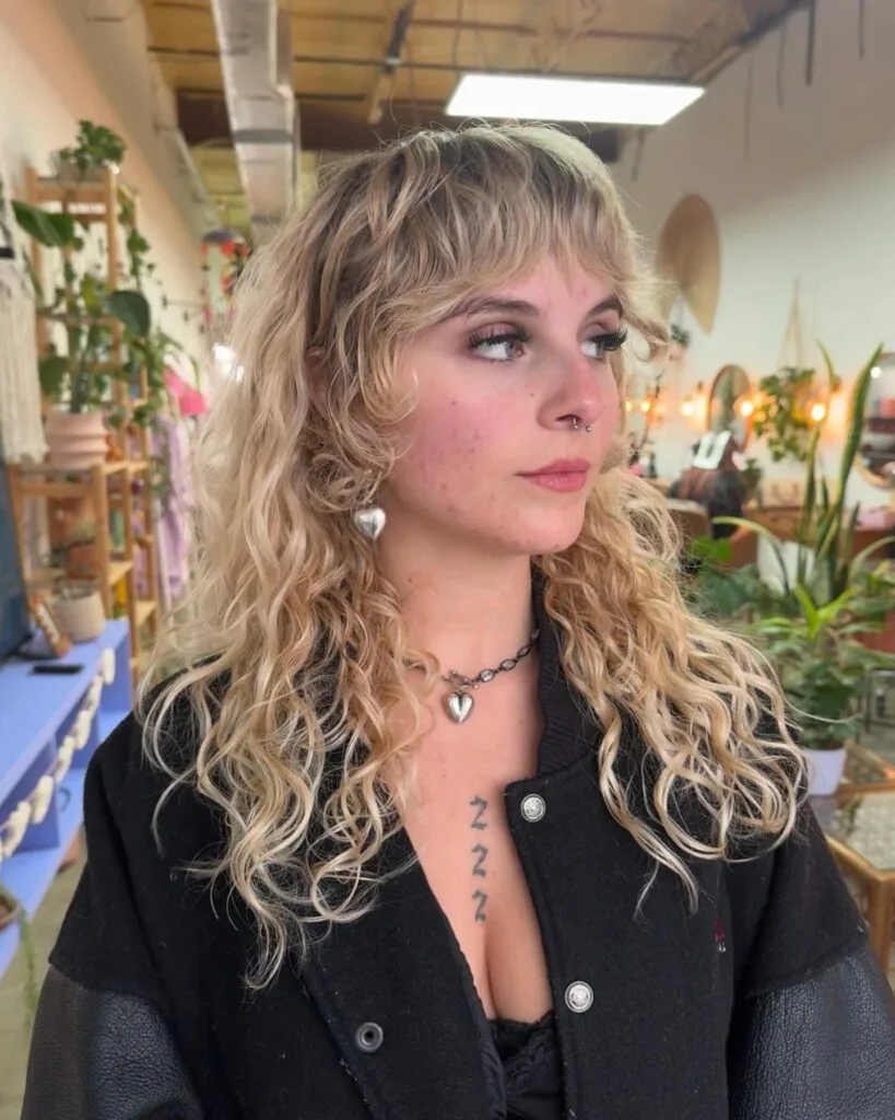 6. Wavy Blonde Fringe Mullet