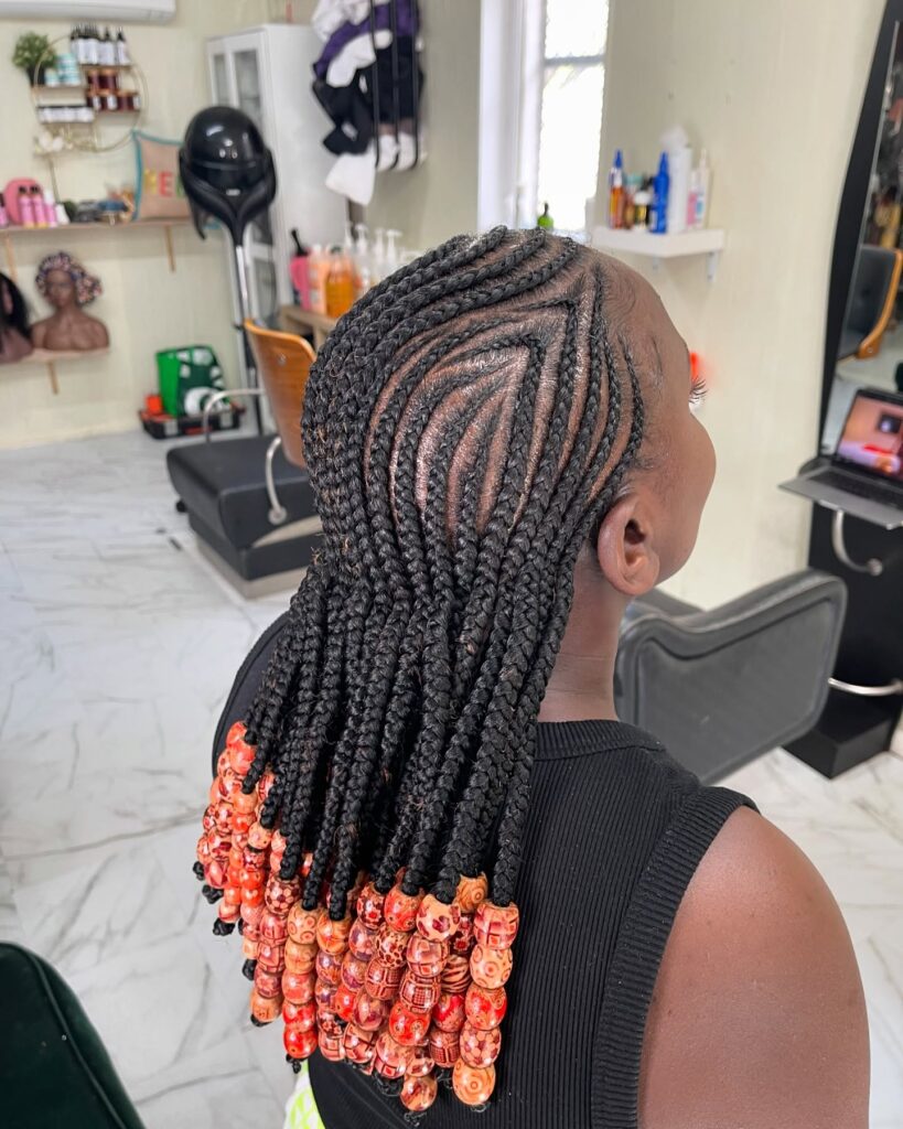 3. Curved Cornrows with Beaded Ends