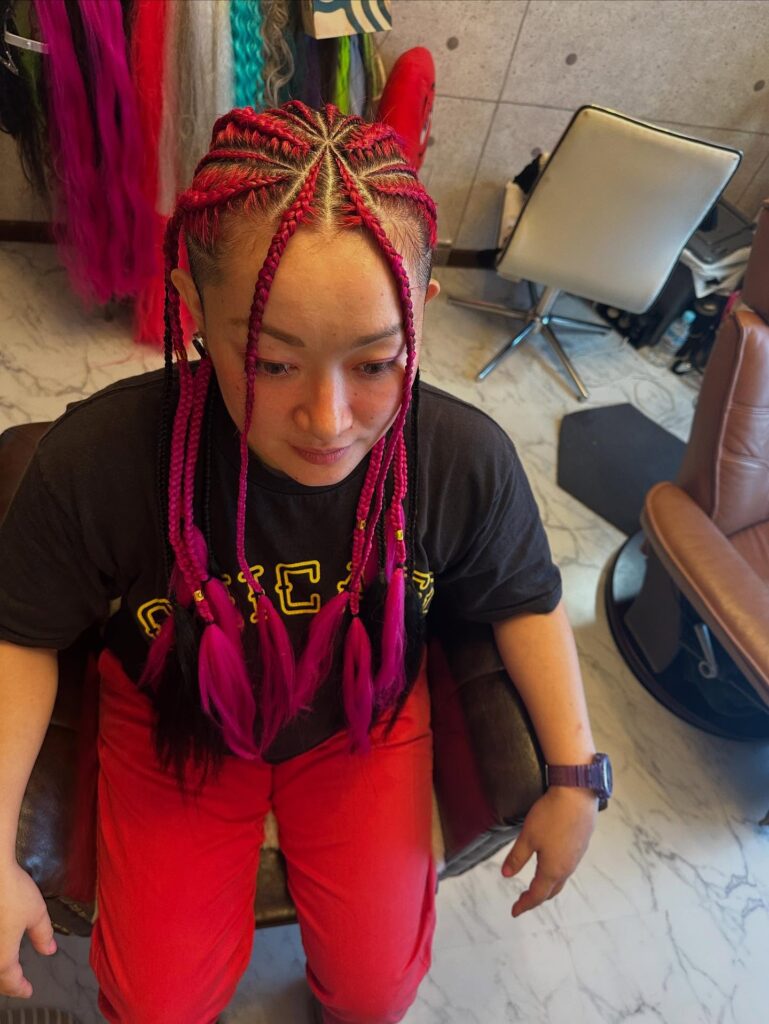 13. Hot Pink Cornrows with Feathered Ends